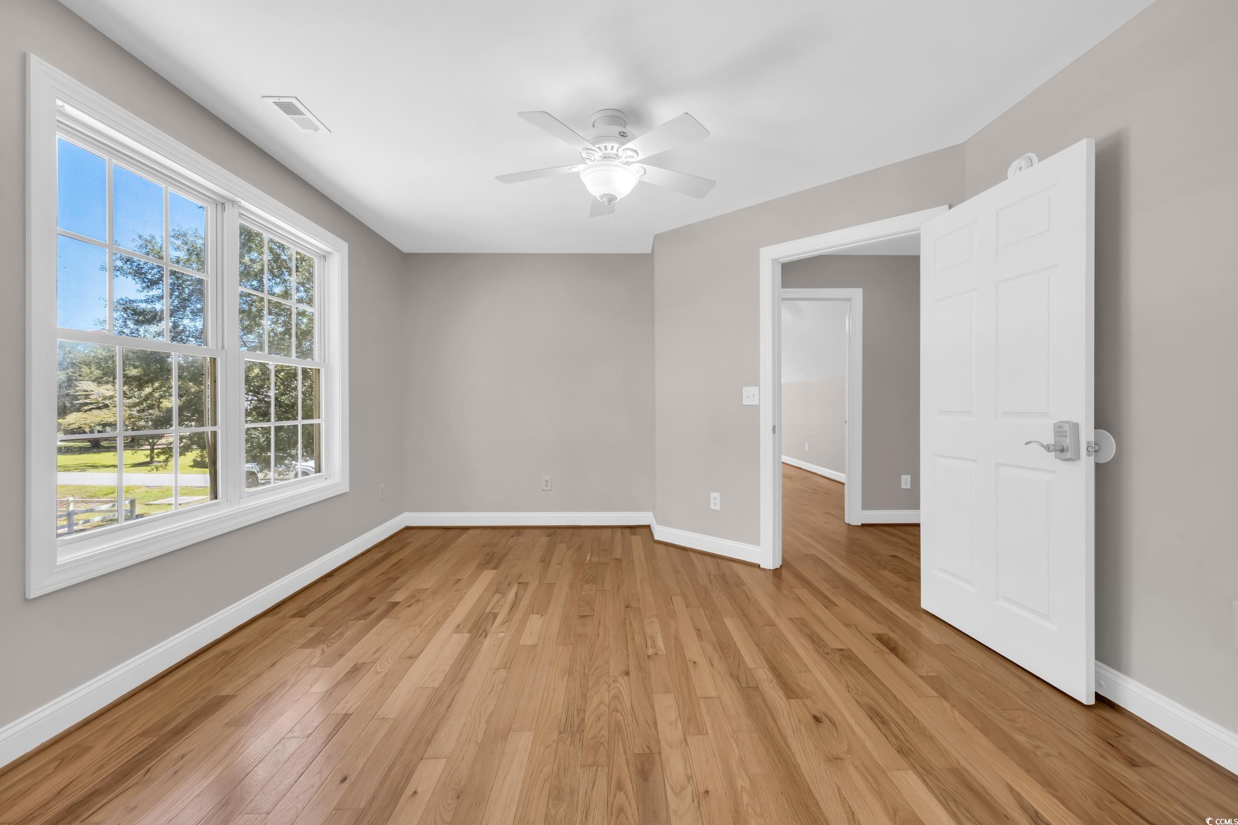 208 Lander Drive Conway, SC 29526 - Photo 27 of 40 Unfurnished room featuring light wood finished floors and a ceiling fan