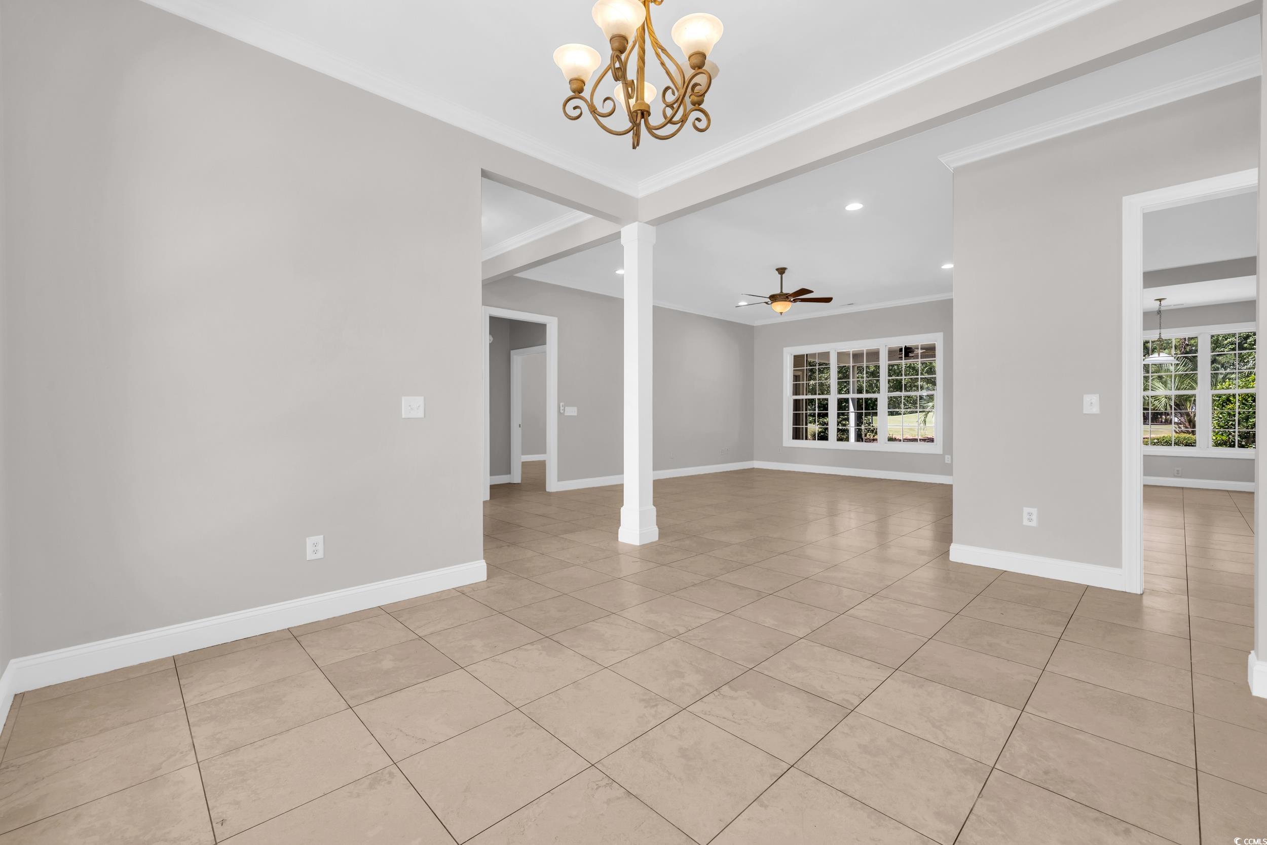208 Lander Drive Conway, SC 29526 - Photo 3 of 40 Unfurnished room featuring a chandelier, light tile patterned floors, ceiling fan, recessed lighting, and ornamental molding