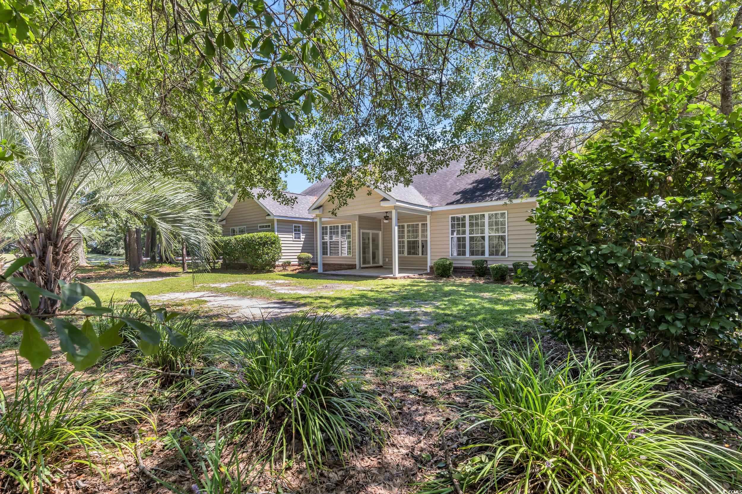 208 Lander Drive Conway, SC 29526 - Photo 36 of 40 View of front of property with a patio, a front yard, and a shingled roof