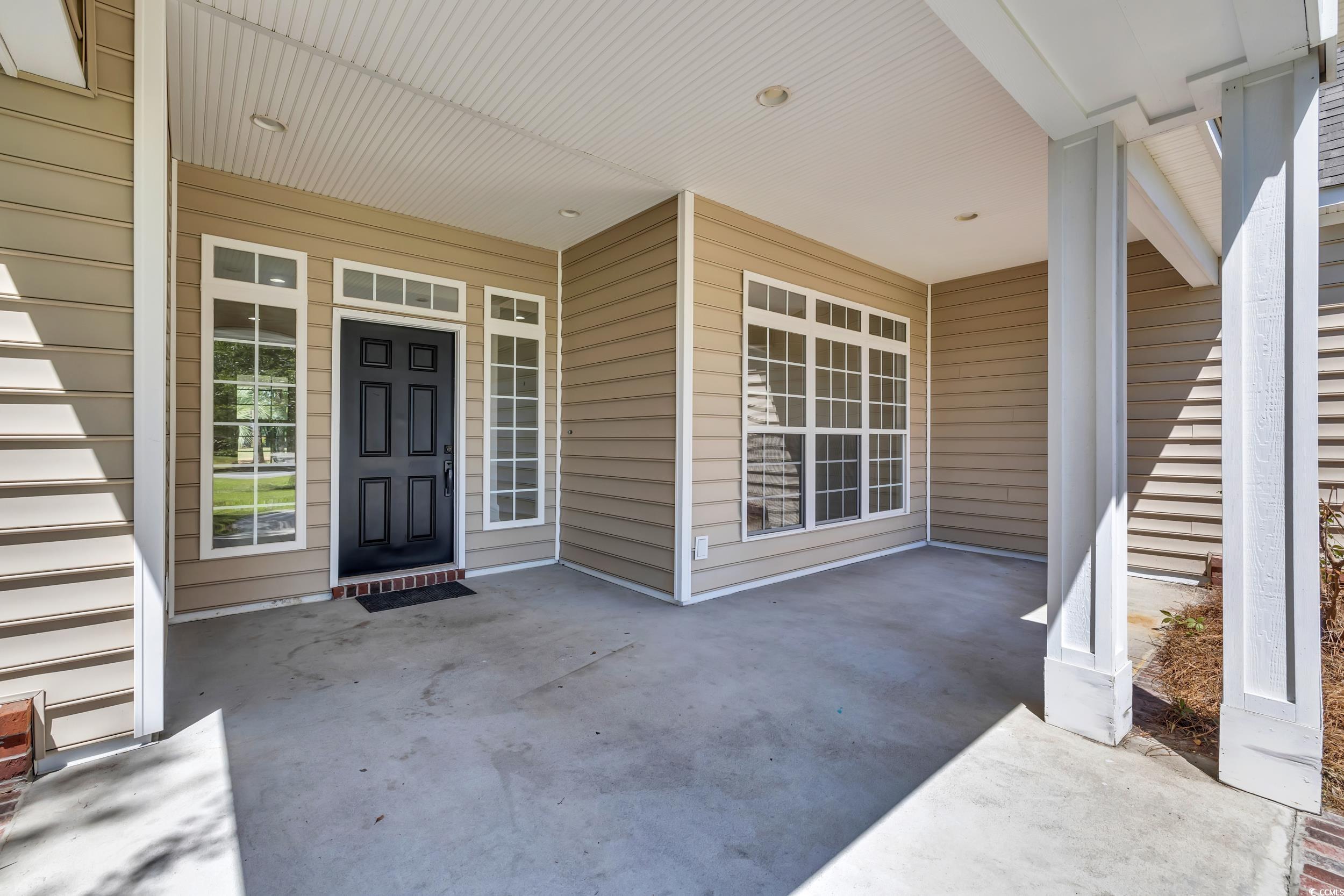 208 Lander Drive Conway, SC 29526 - Photo 6 of 40 Property entrance with a patio area