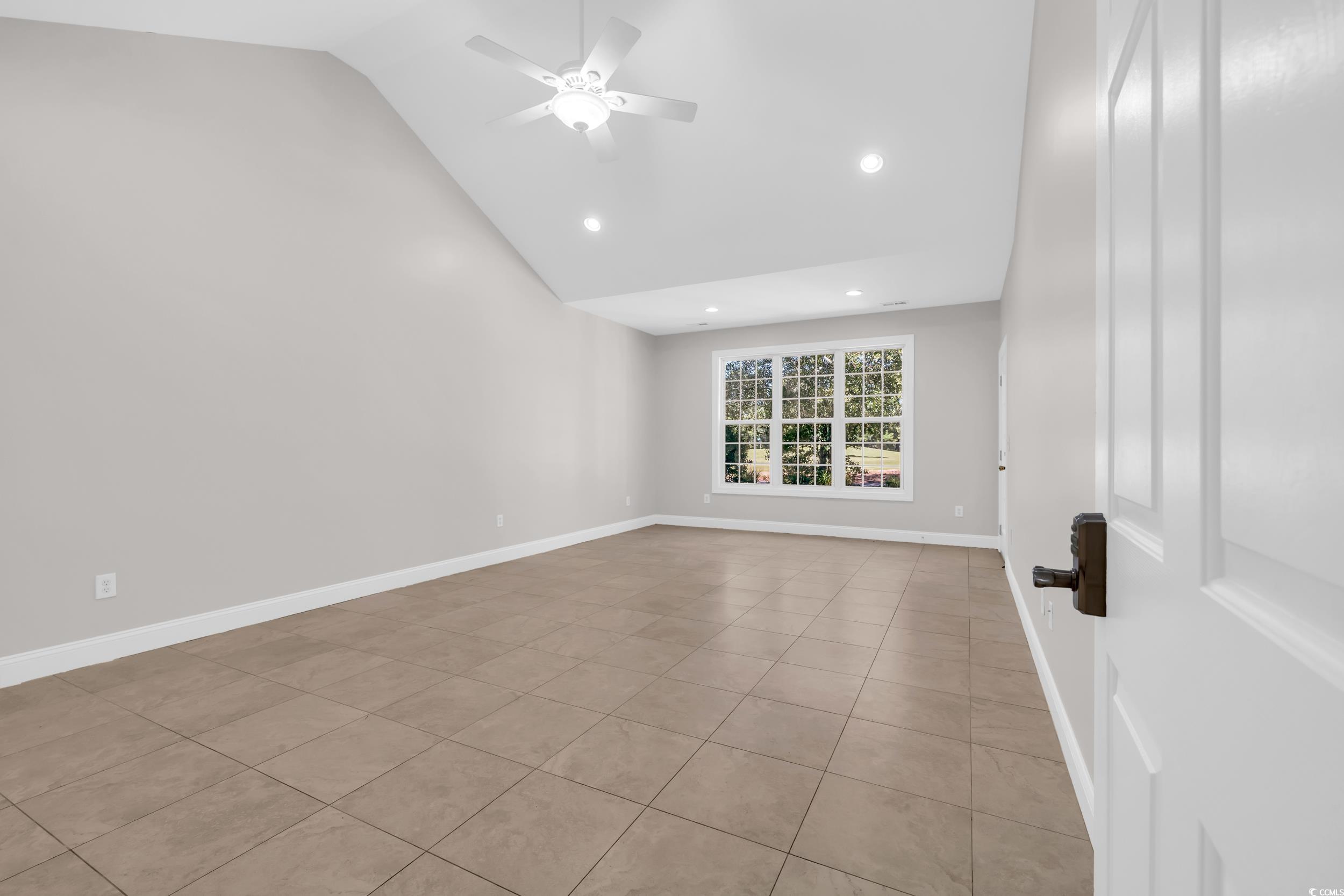 208 Lander Drive Conway, SC 29526 - Photo 9 of 40 Unfurnished room with light tile patterned flooring, ceiling fan, recessed lighting, and high vaulted ceiling