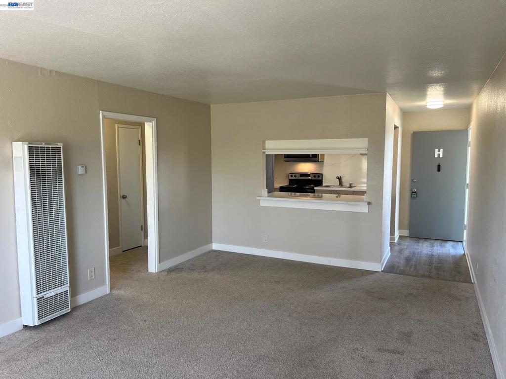 36976 Mulberry Street Newark, CA 94560 - Photo 12 of 34 a view of a livingroom with wooden floor and a flat screen tv