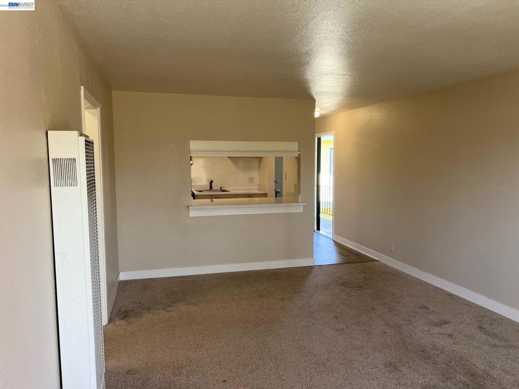 36976 Mulberry Street Newark, CA 94560 - Photo 13 of 34 an empty room with a empty space and windows