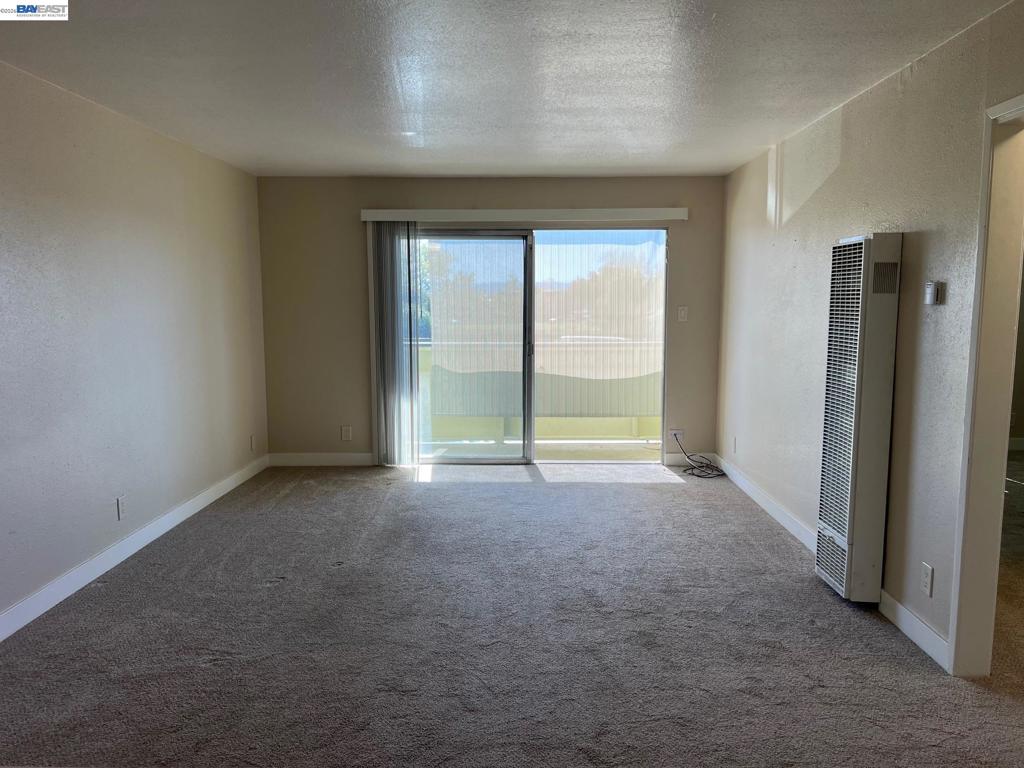 36976 Mulberry Street Newark, CA 94560 - Photo 18 of 34 an empty room with an empty space and windows