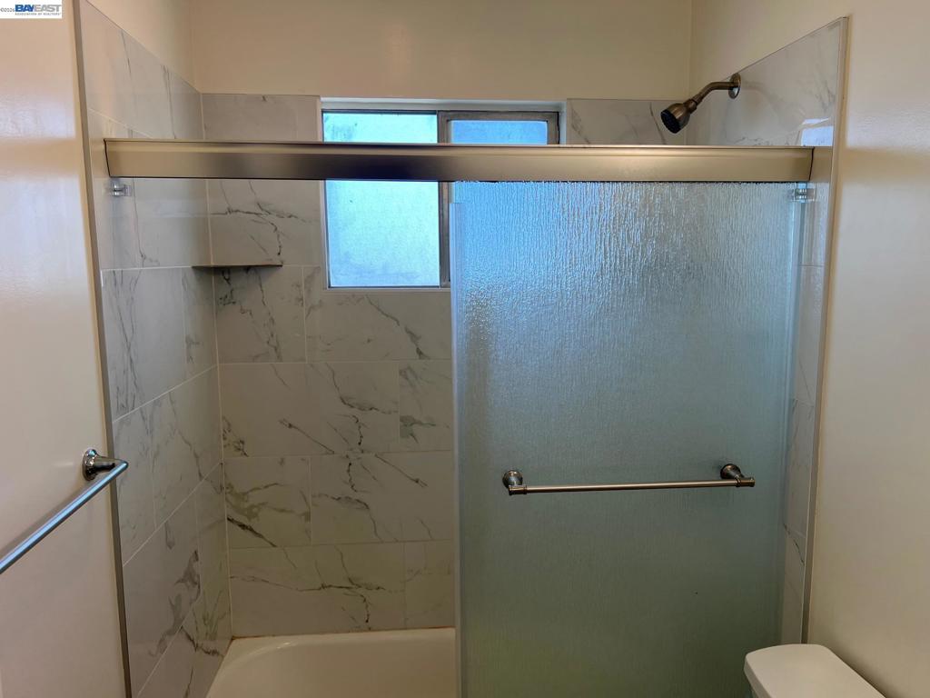 36976 Mulberry Street Newark, CA 94560 - Photo 21 of 34 a bathroom with a shower and toilet