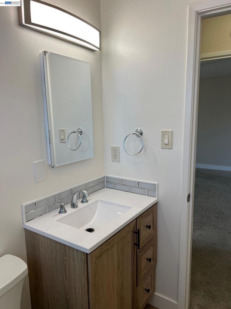36976 Mulberry Street Newark, CA 94560 - Photo 22 of 34 a bathroom with a sink and a mirror