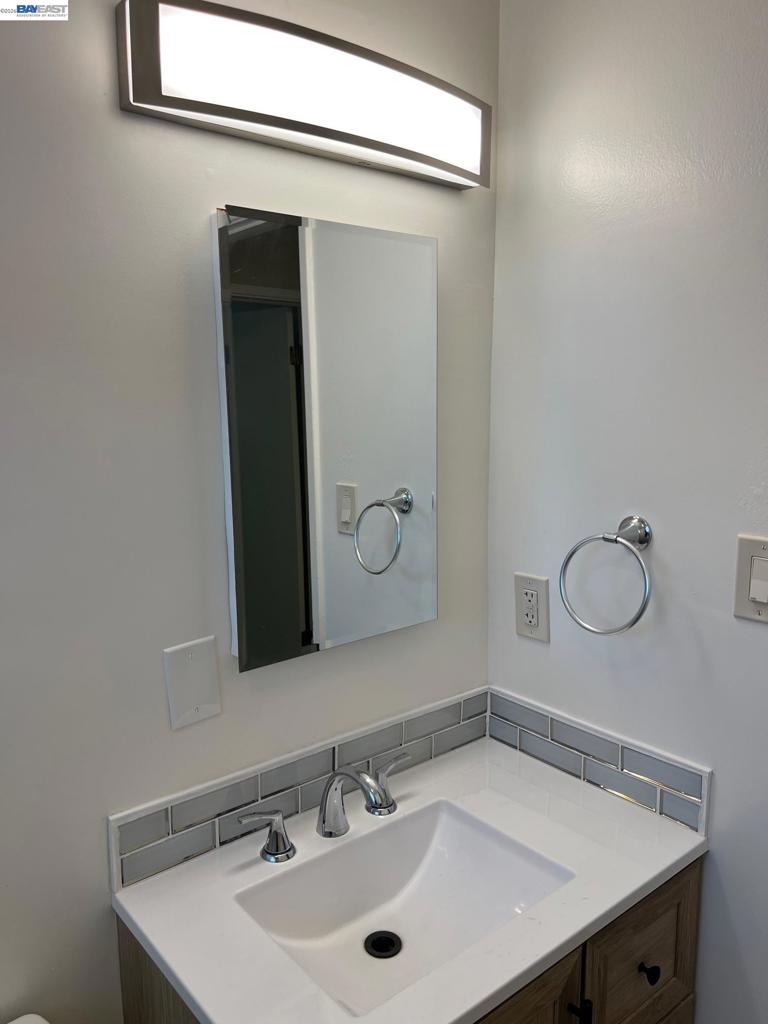 36976 Mulberry Street Newark, CA 94560 - Photo 23 of 34 a bathroom with a sink and a mirror