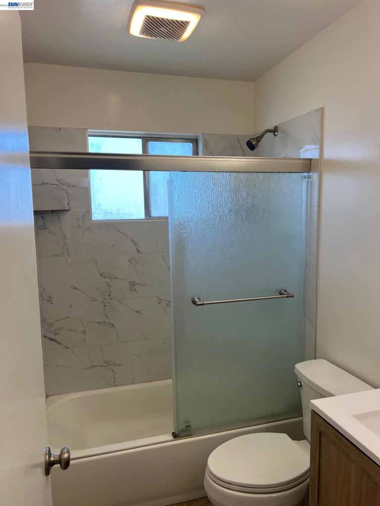 36976 Mulberry Street Newark, CA 94560 - Photo 24 of 34 a bathroom with a toilet a sink and shower