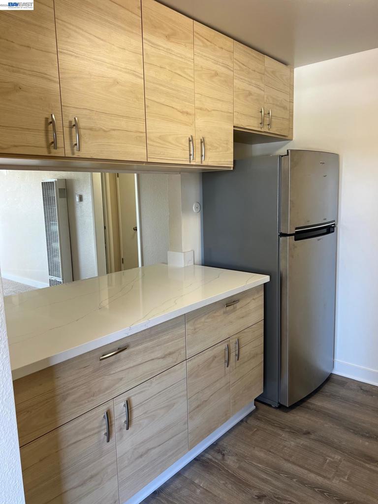 36976 Mulberry Street Newark, CA 94560 - Photo 4 of 34 a kitchen with a refrigerator and cabinets
