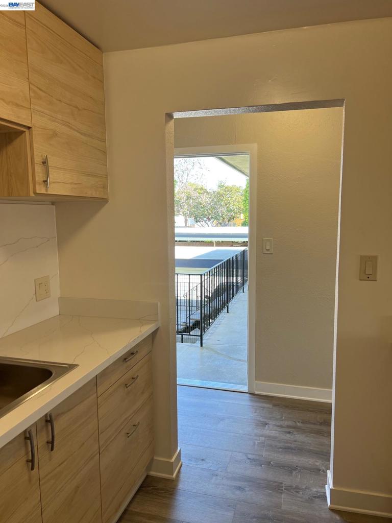 36976 Mulberry Street Newark, CA 94560 - Photo 9 of 34 a view of a kitchen with wooden floor and a sink