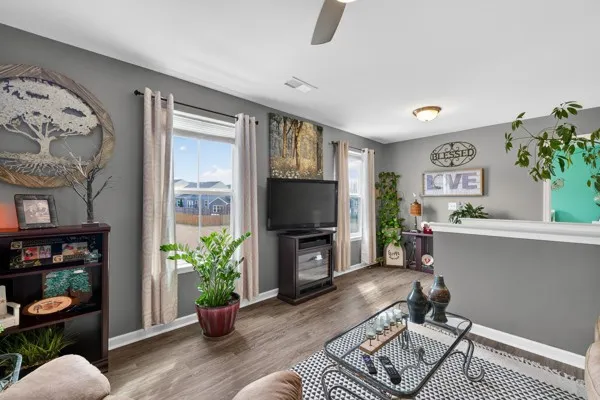 a living room with furniture and a flat screen tv