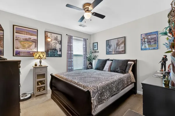 a bed room with a bed and a chandelier