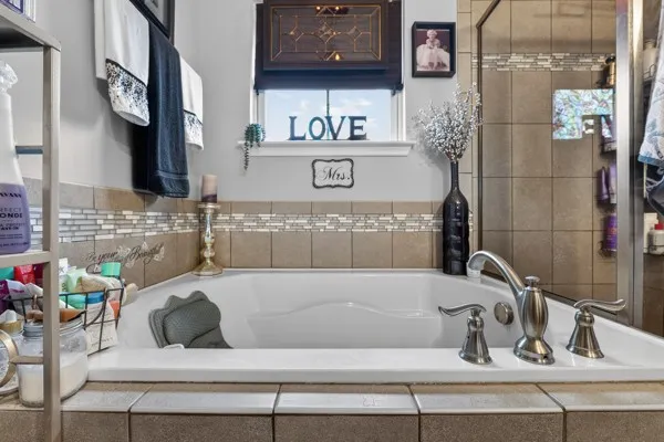 a bathroom with a bathtub and sink