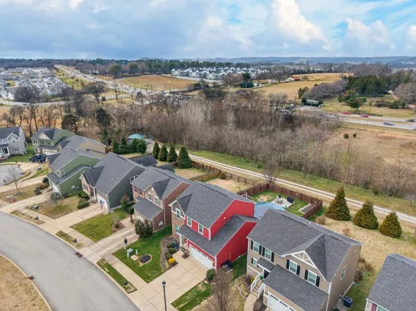 an aerial view of a house with a lake view