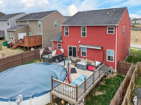 a front view of house with yard outdoor seating and barbeque oven