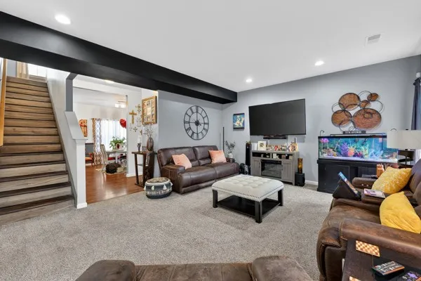 a living room with furniture and a flat screen tv