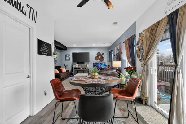 a view of a dining room with furniture window and wooden floor