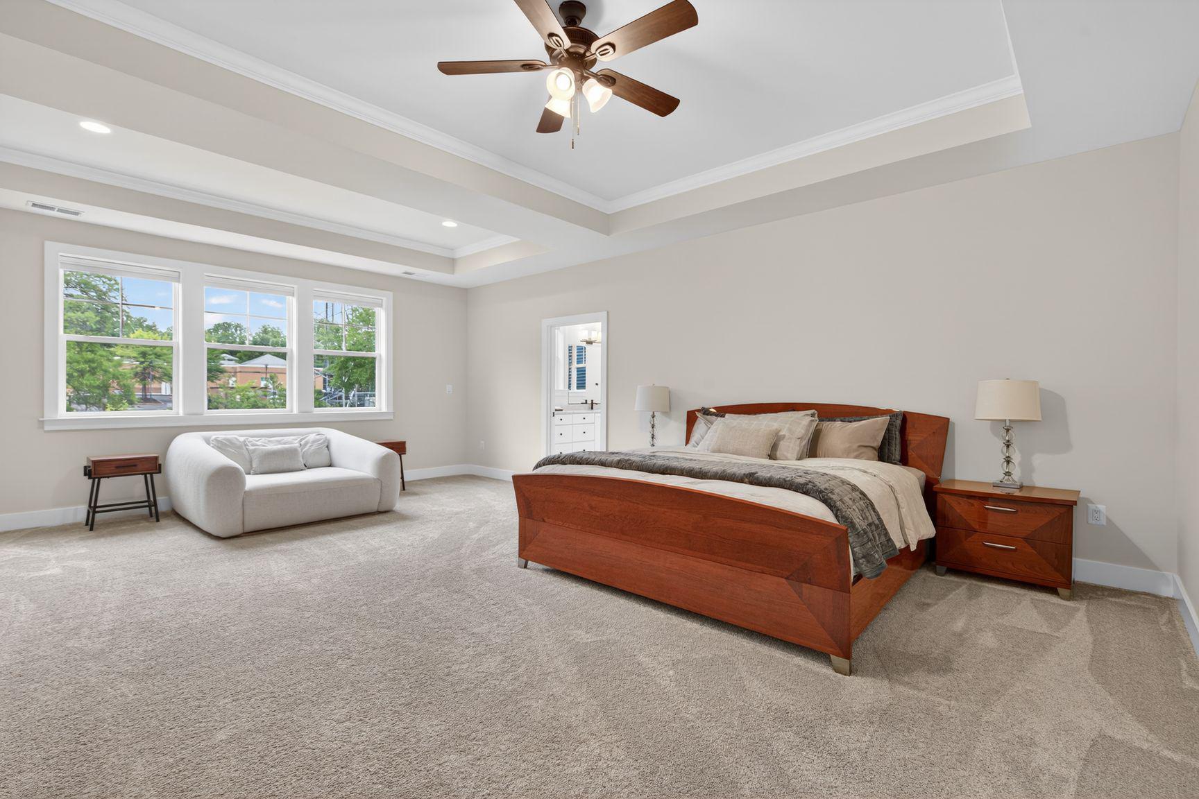 6213 Mcconnell Lane Springfield, VA 22152 - Photo 17 of 39 a spacious bedroom with a bed and a couch