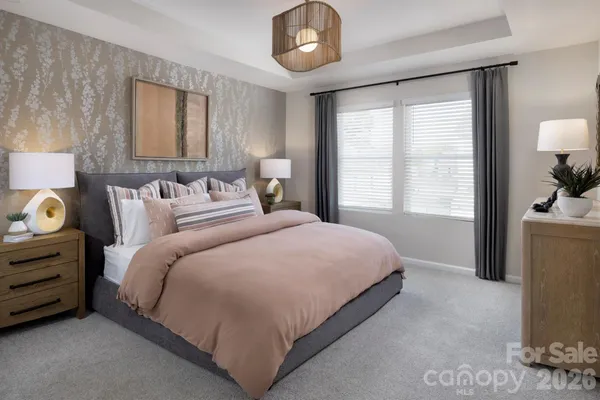 a bedroom with bed and window