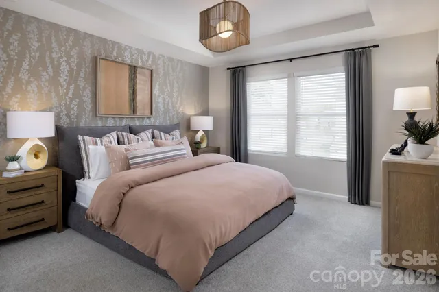 a bedroom with bed and window