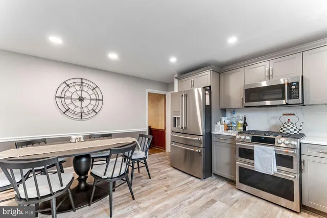 a living room with furniture fireplace and a flat screen tv