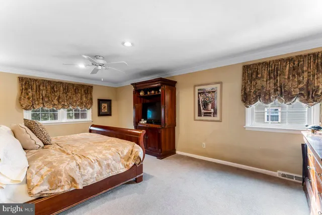 a bathroom with a granite countertop sink a mirror and a window