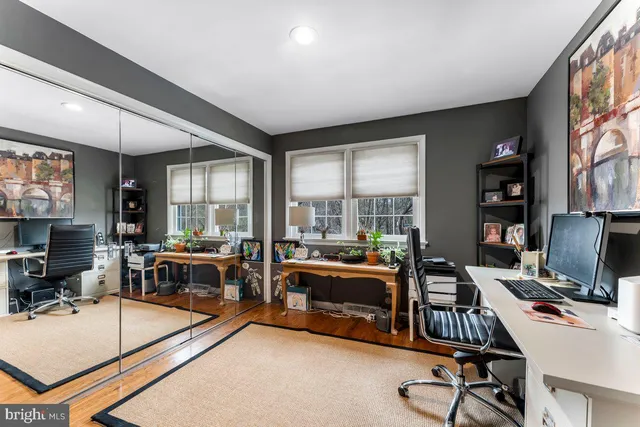 a bedroom with a bed furniture and a book shelf