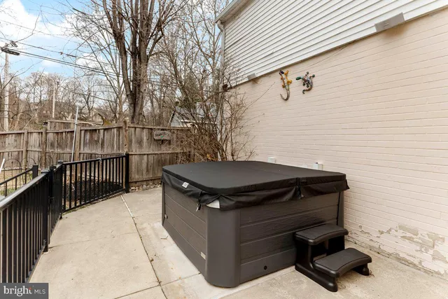 a view of a backyard with sitting area