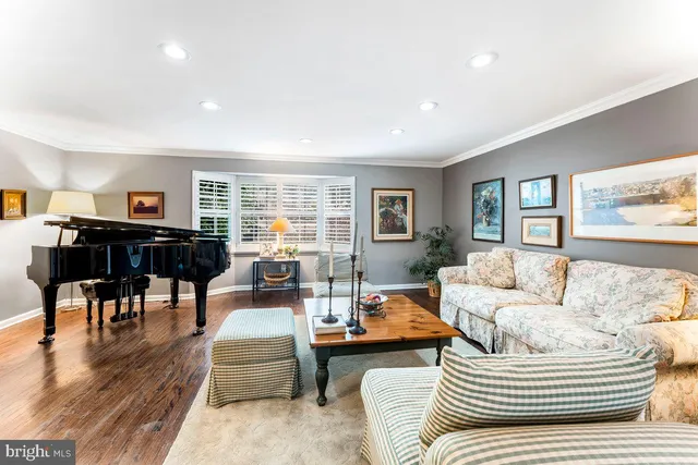a kitchen with a sink a window and cabinets