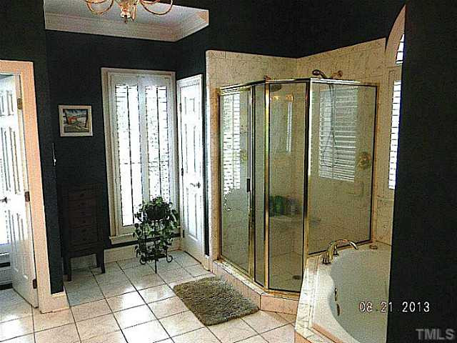 5205 Deergrass Court Raleigh, NC 27613 - Photo 14 of 25 Custom Shower, tiled floors and natural lighting await you in your Master Bath. Master Bath/Spa