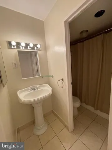 a bathroom with a glass shower door