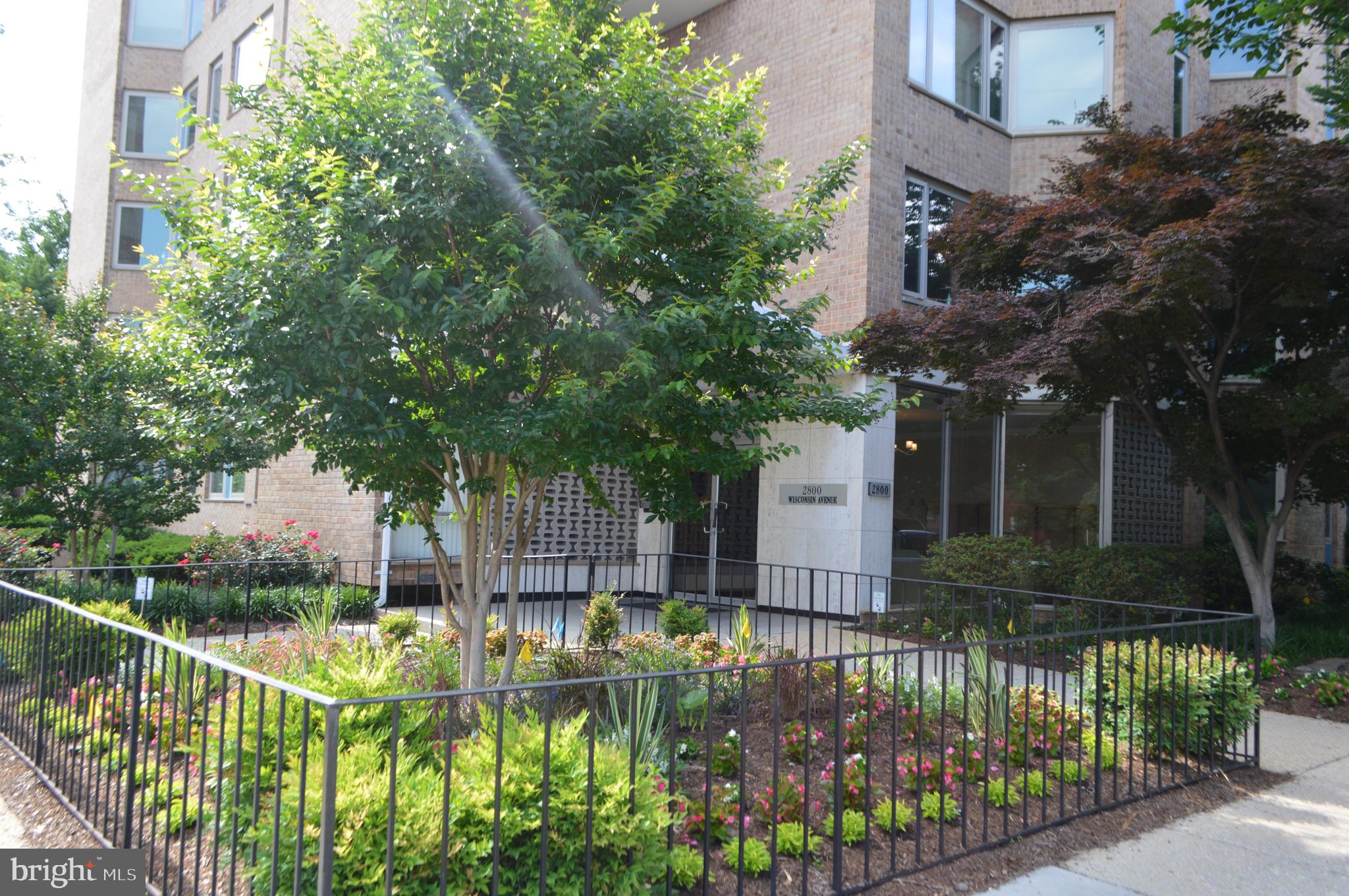 2800 Wisconsin Avenue Northwest, Unit 601 Washington, DC 20007 - Photo 22 of 23 a front view of a house with a garden