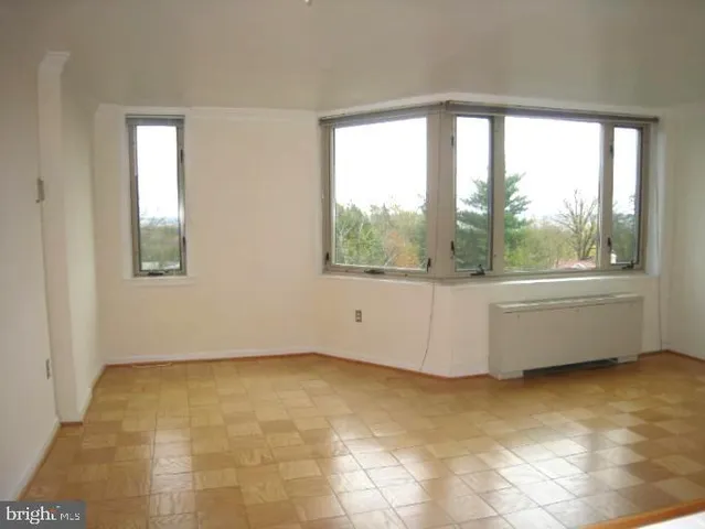 a view of a room that has a window in it