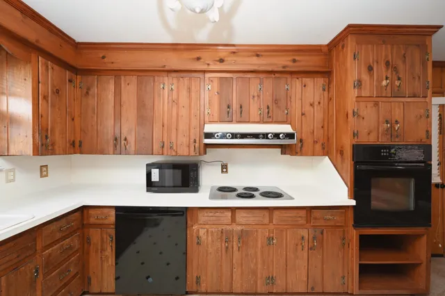a kitchen with stainless steel appliances a stove and a refrigerator