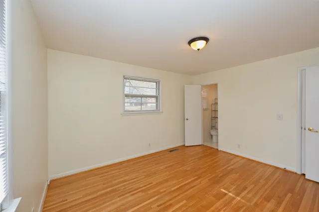 a bathroom with a shower a toilet and sink