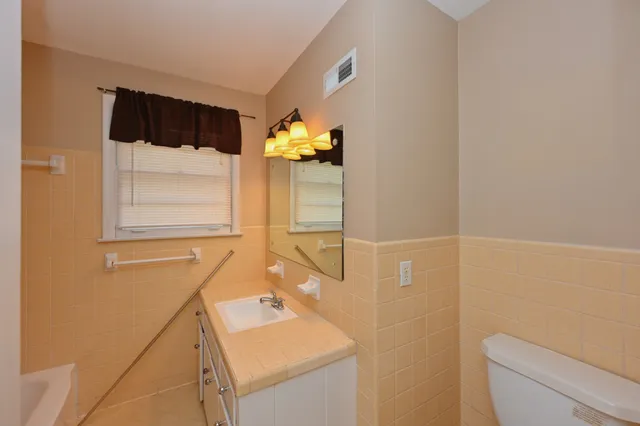 a bathroom with a tub and a shower