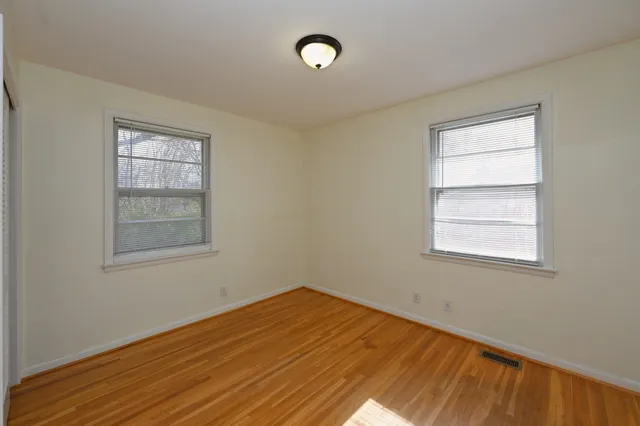 a view of kitchen with furniture and refrigerator