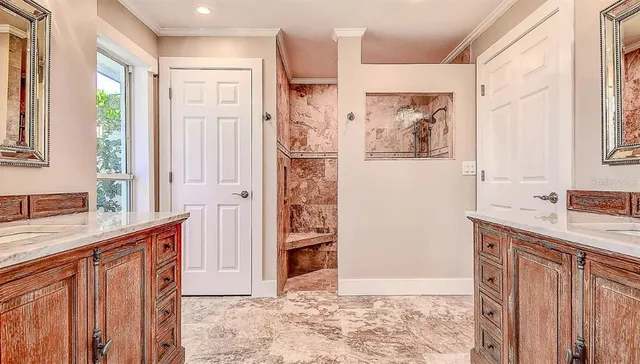a bathroom with a granite countertop sink a mirror a shower and a bathtub