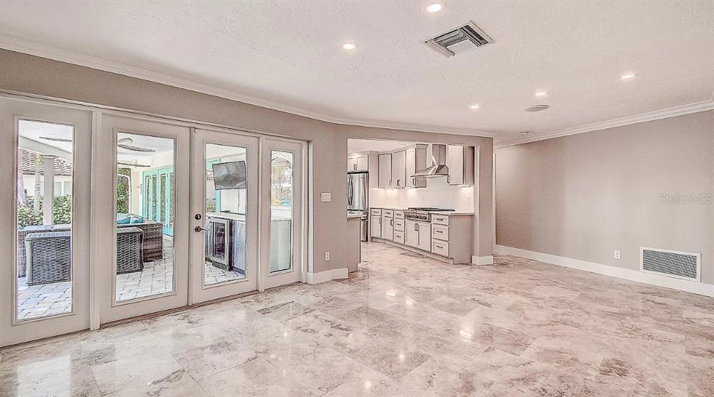1998 Kansas Avenue Northeast St. Petersburg, FL 33703 - Photo 8 of 14 a view of a livingroom with wooden floor and a ceiling fan