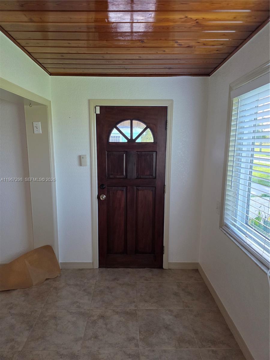 4321 Kirby Loop Road, Unit 1 Fort Pierce, FL 34981 - Photo 12 of 21 a view of empty room with windows