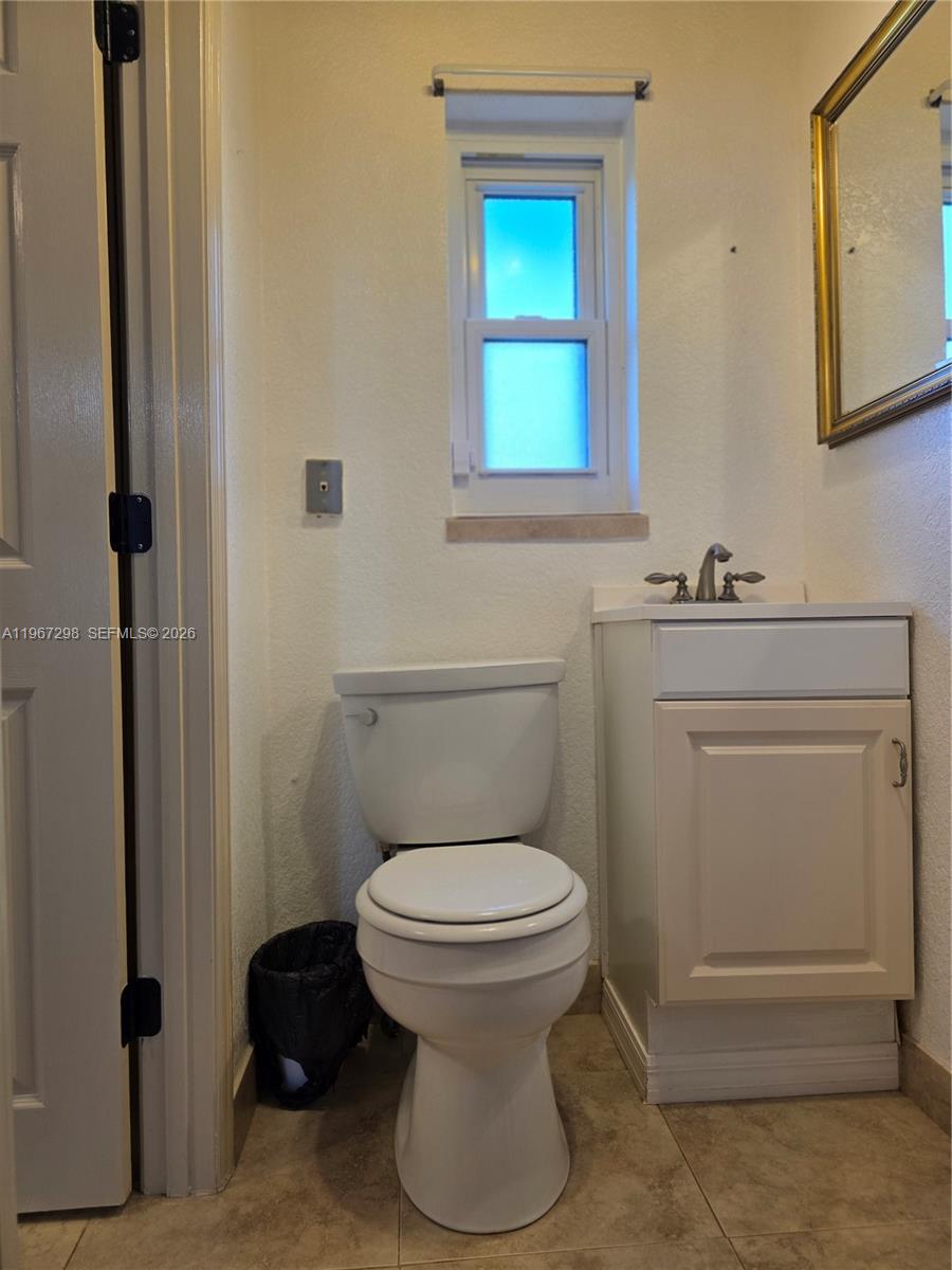 4321 Kirby Loop Road, Unit 1 Fort Pierce, FL 34981 - Photo 17 of 21 a bathroom with a toilet and a sink