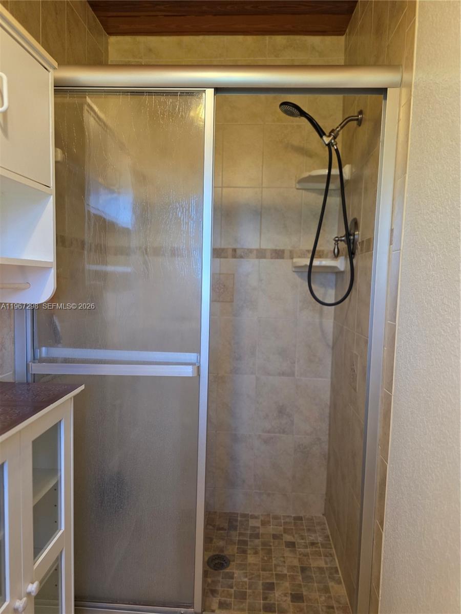 4321 Kirby Loop Road, Unit 1 Fort Pierce, FL 34981 - Photo 19 of 21 a bathroom with a shower