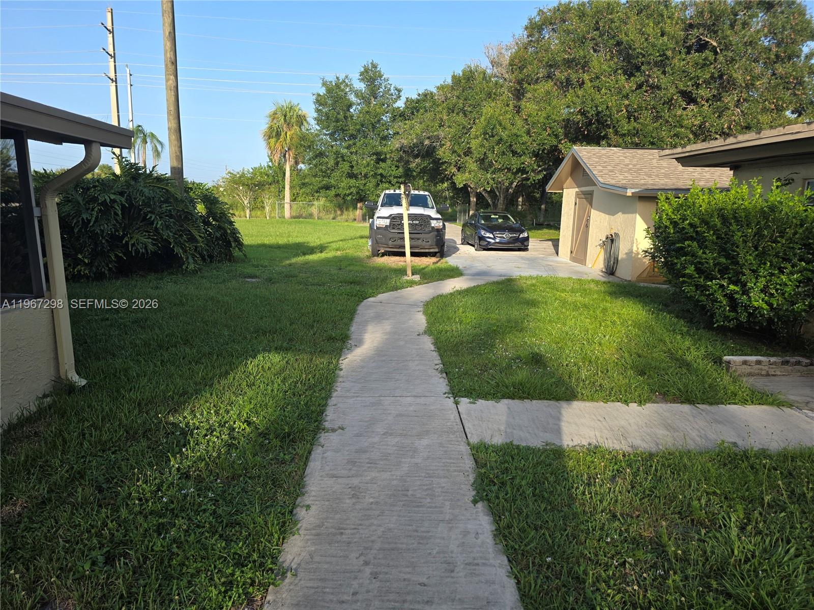 4321 Kirby Loop Road, Unit 1 Fort Pierce, FL 34981 - Photo 21 of 21 a front view of a house with a yard