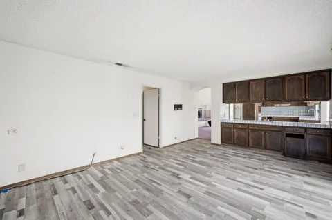 a kitchen with stainless steel appliances a sink and a large window