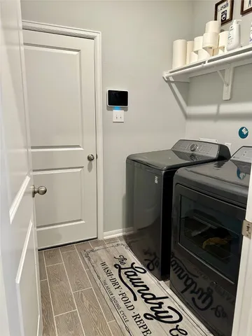 a utility room with dryer and washer