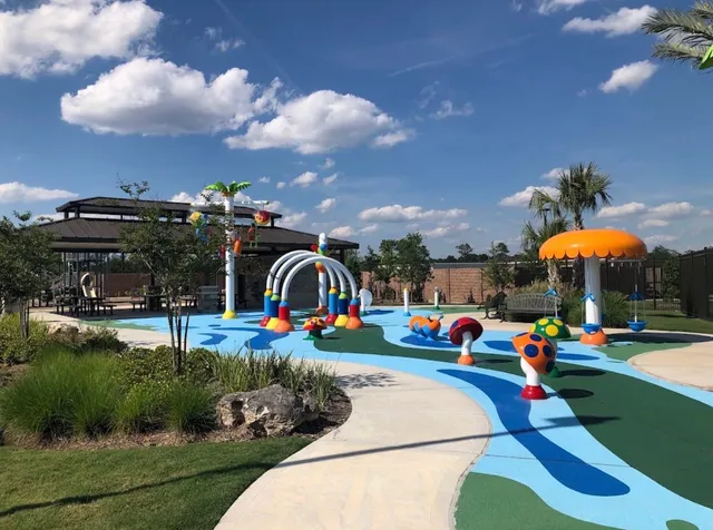 a childrens park with lots of swings and slides