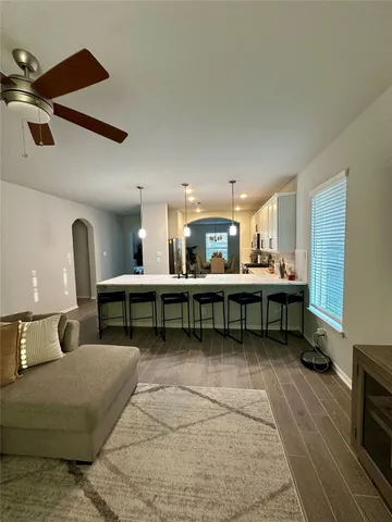 a living room with lots of furniture and a table