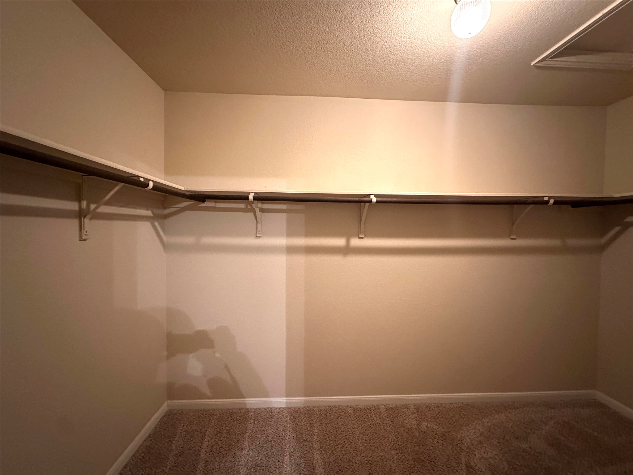 1000 Drake Cove Leander, TX 78641 - Photo 15 of 24 a view of a room with racks on the wall