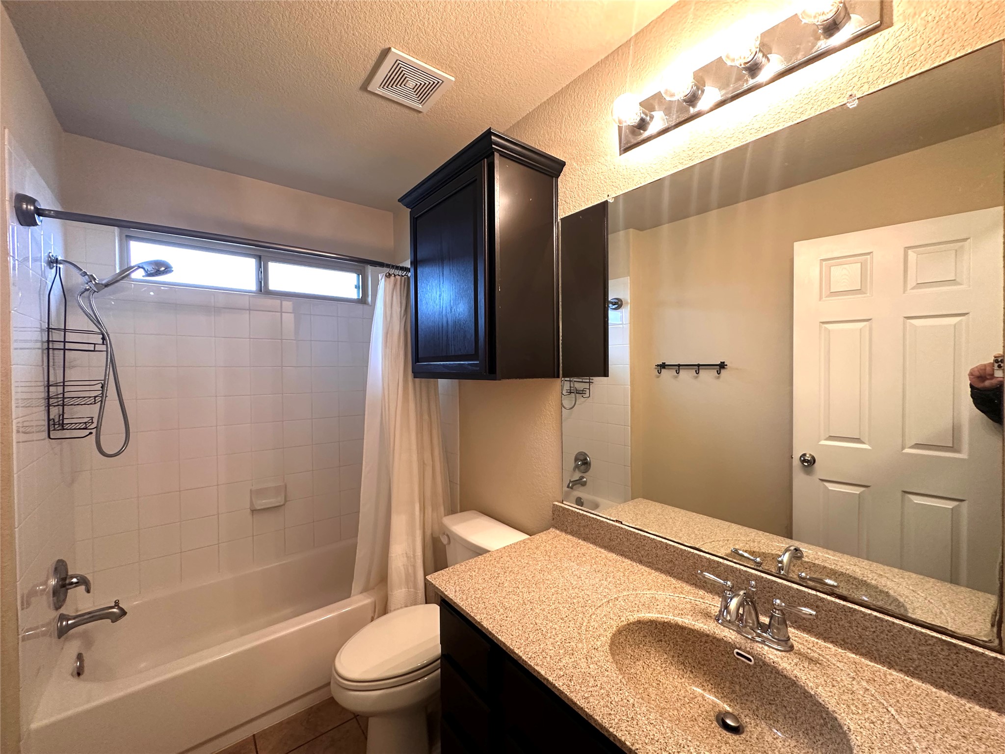 1000 Drake Cove Leander, TX 78641 - Photo 8 of 24 a bathroom with a granite countertop sink toilet and shower
