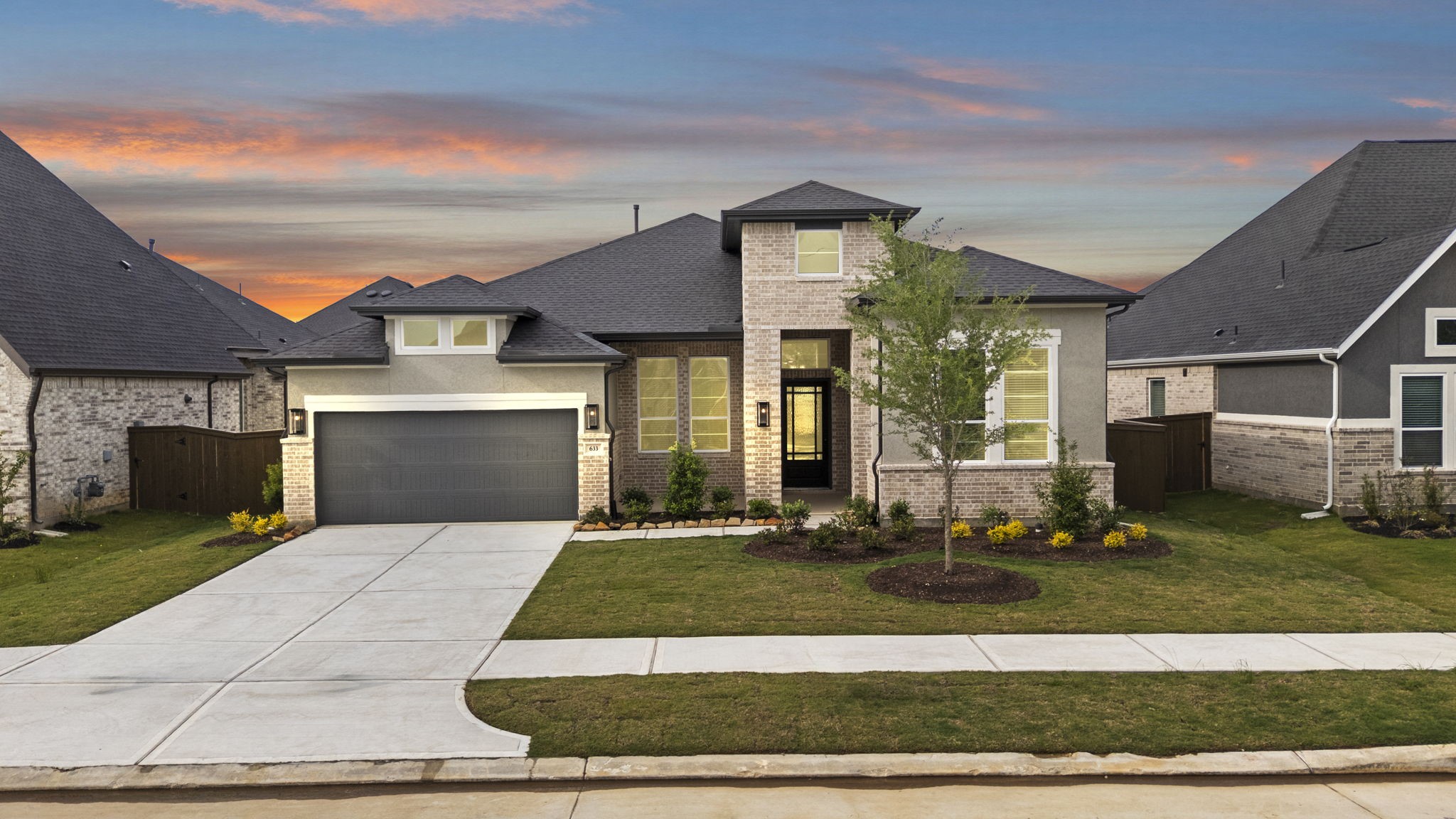 a front view of a house with yard